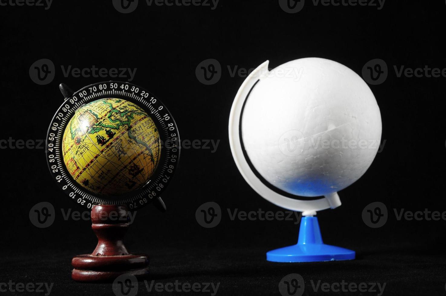 Earth globes on black background photo