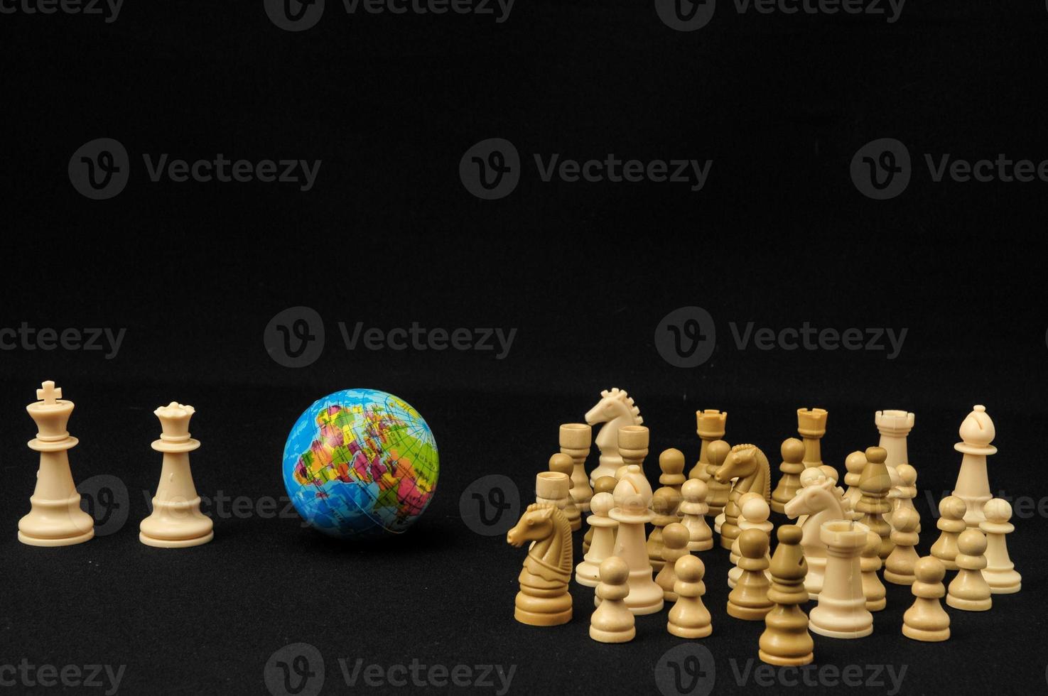 Earth and chess pieces photo