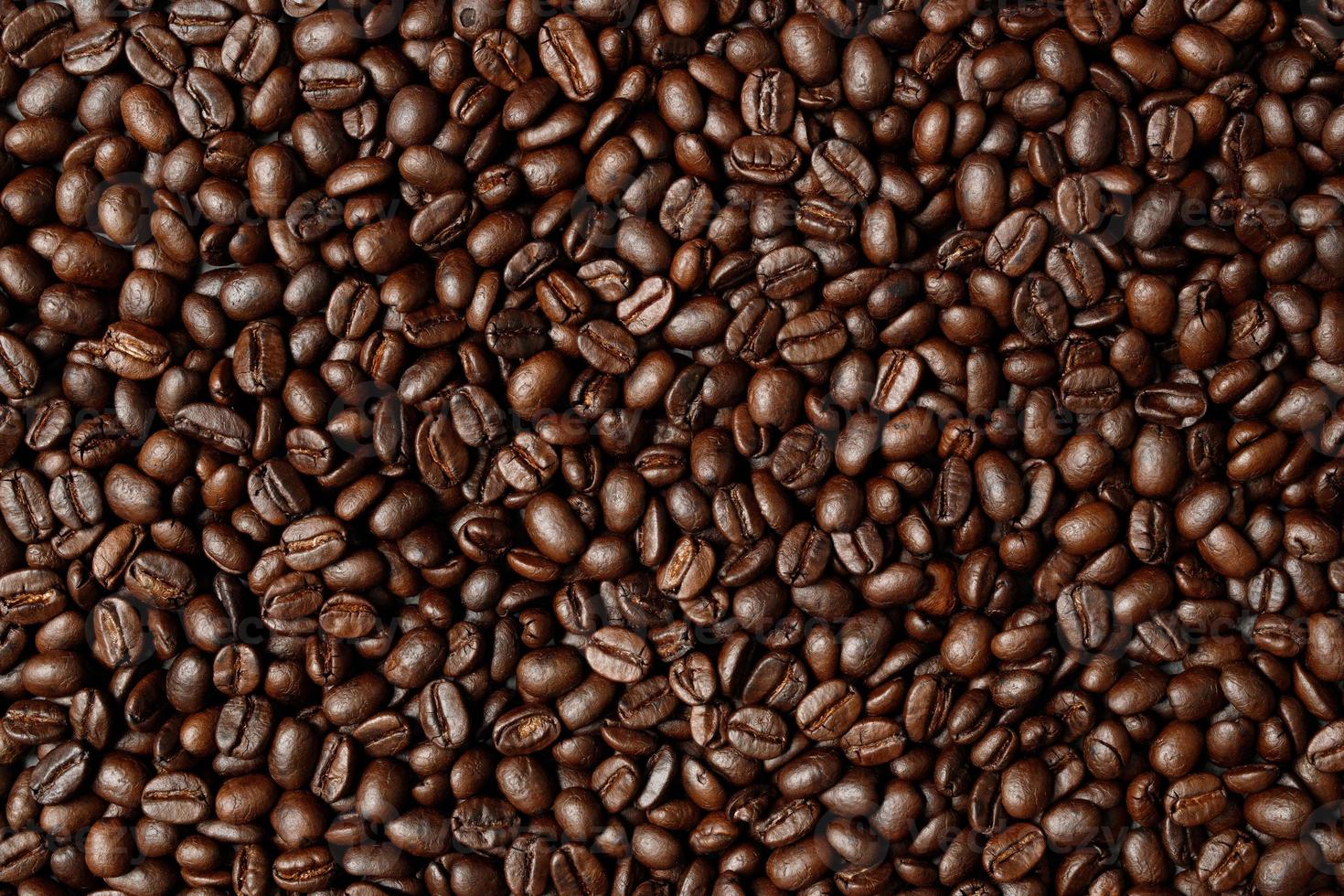 photo macro close up texture of roasted coffee beans dark, can be used as a background.