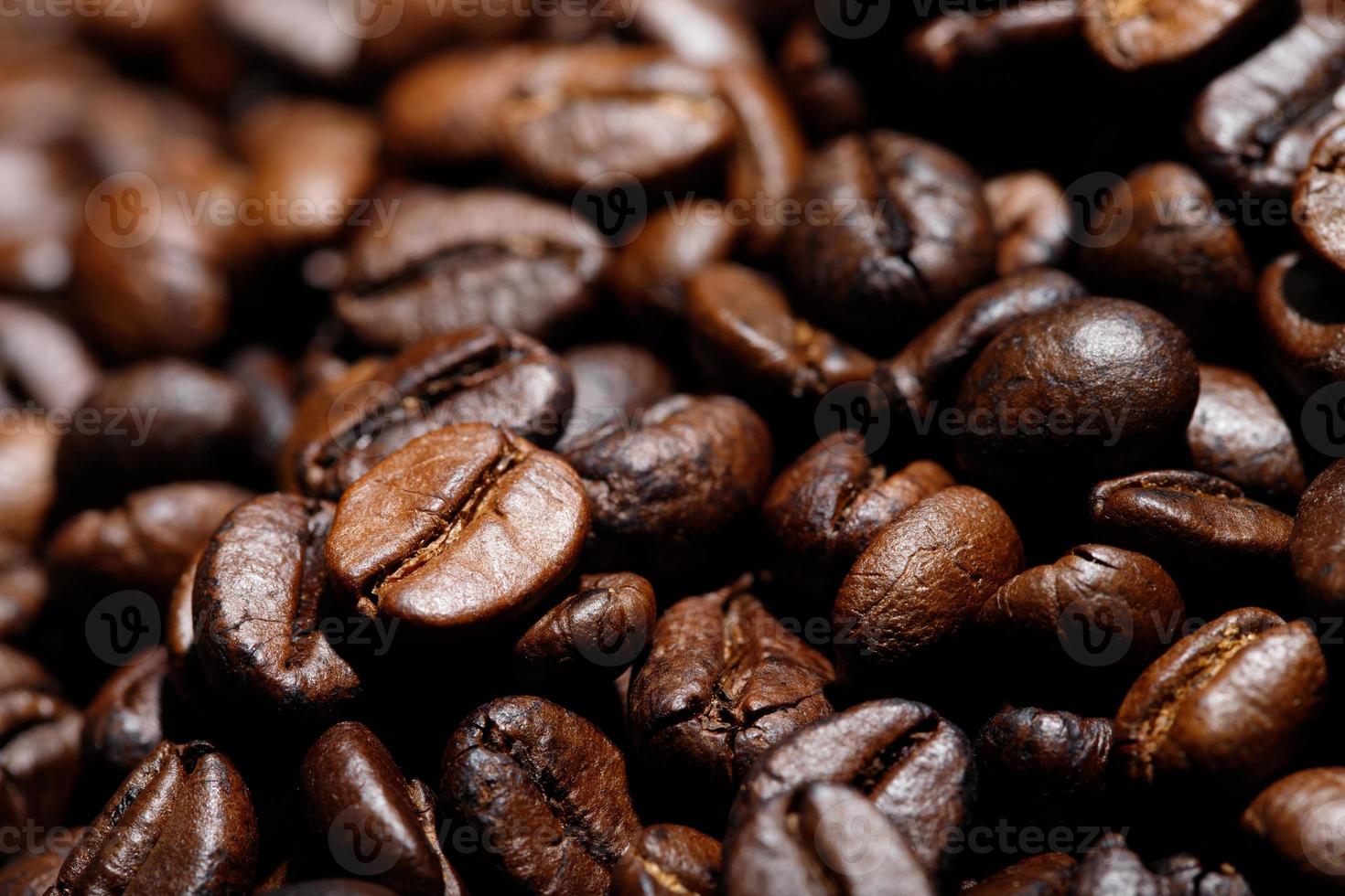 photo macro close up texture of roasted coffee beans dark, can be used as a background.