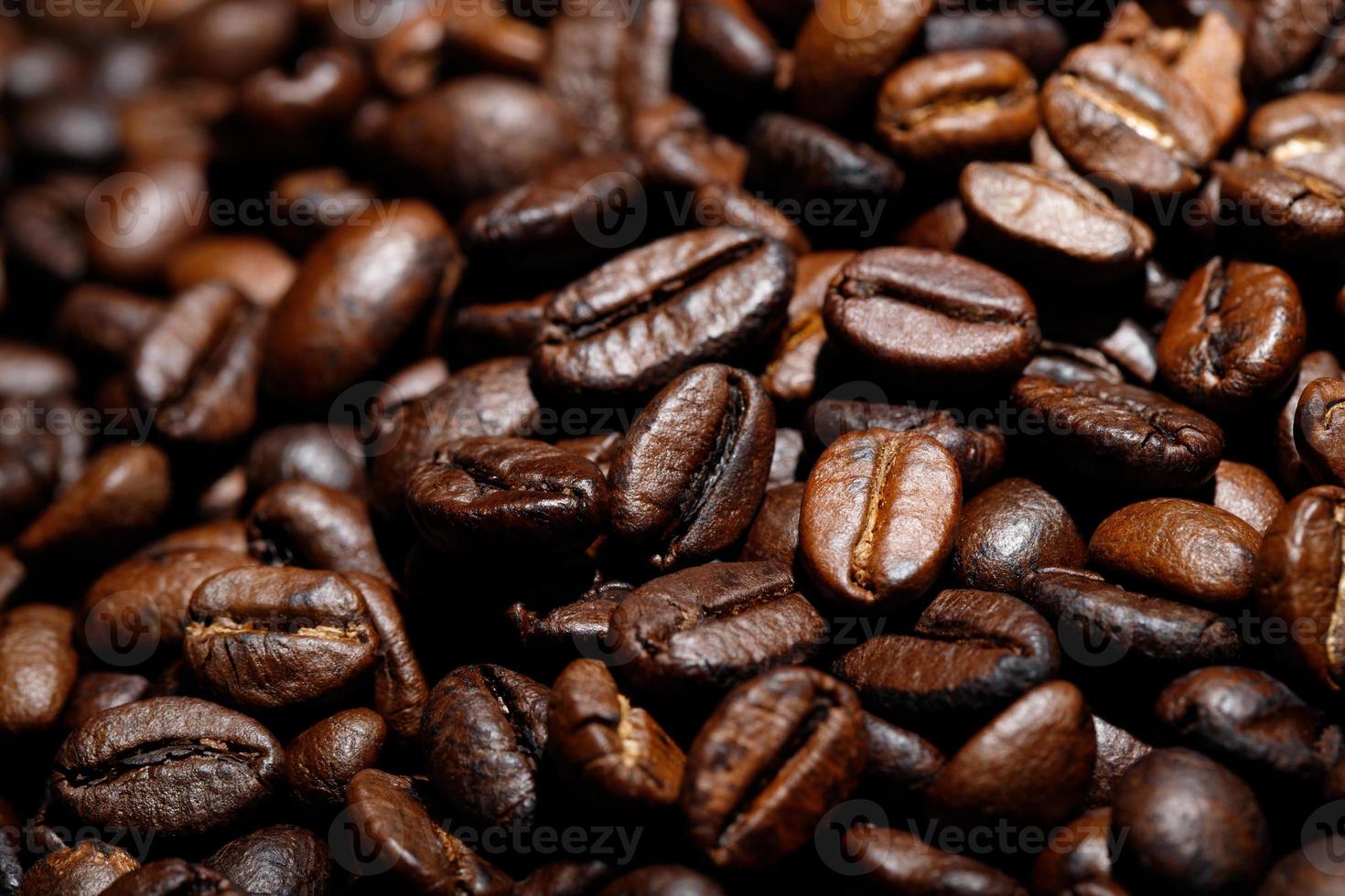 photo macro close up texture of roasted coffee beans dark, can be used as a background.