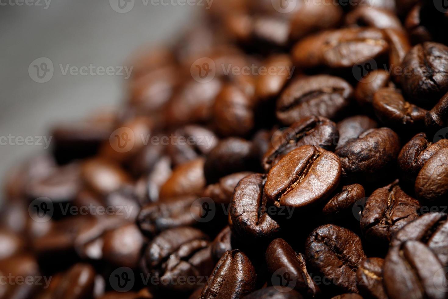 photo macro close up texture of roasted coffee beans dark, can be used as a background.