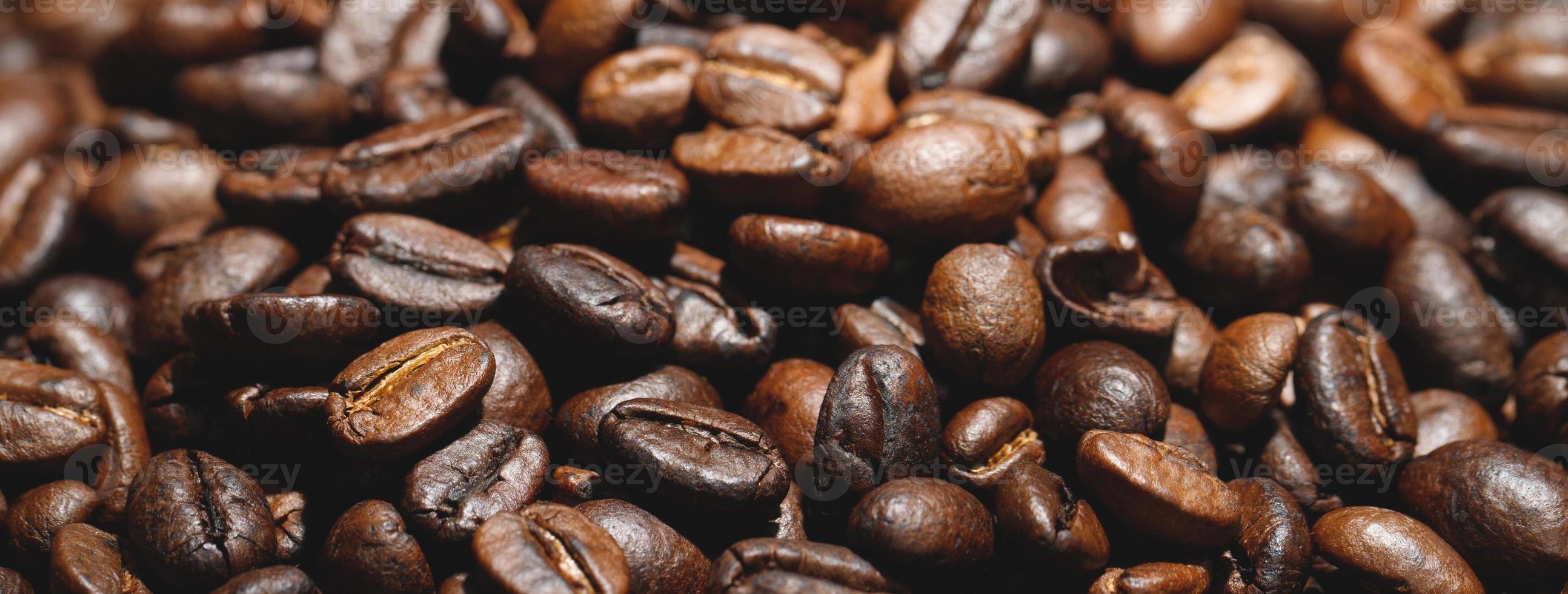 photo macro close up texture of roasted coffee beans dark, can be used as a background.