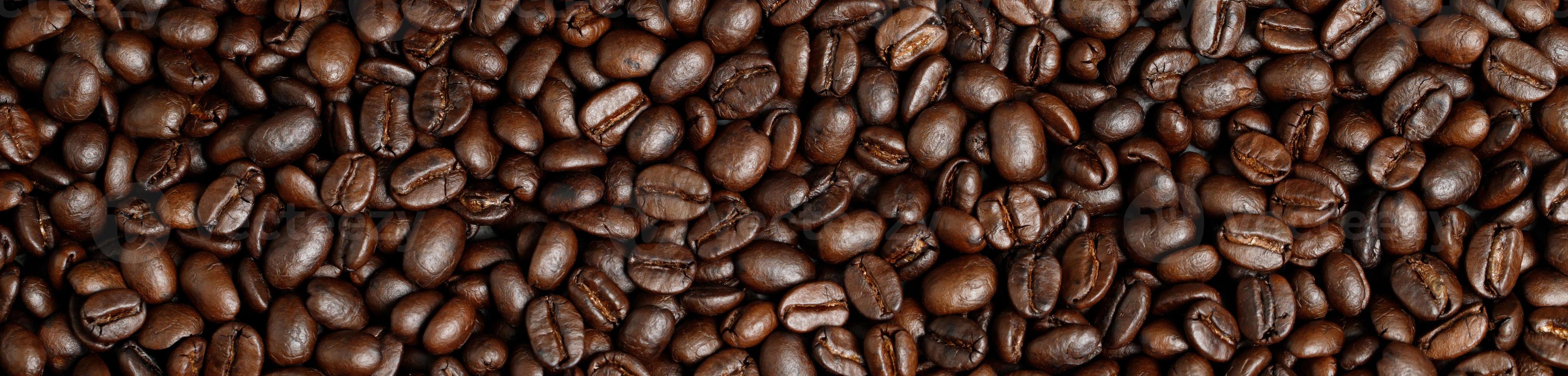 photo macro close up texture of roasted coffee beans dark, can be used as a background.