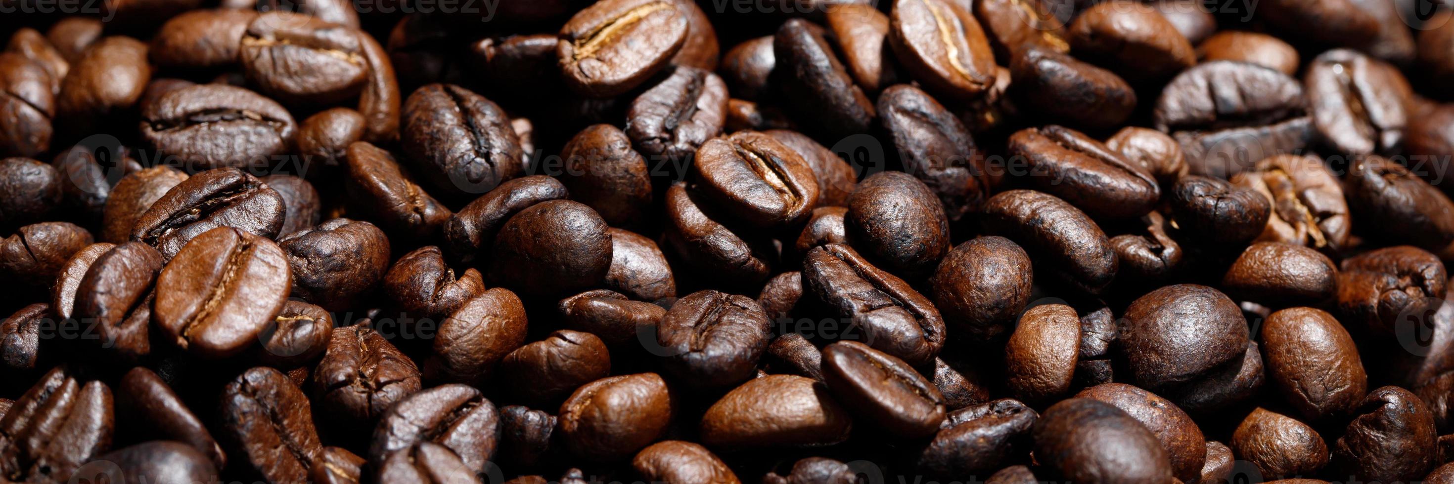 photo macro close up texture of roasted coffee beans dark, can be used as a background.