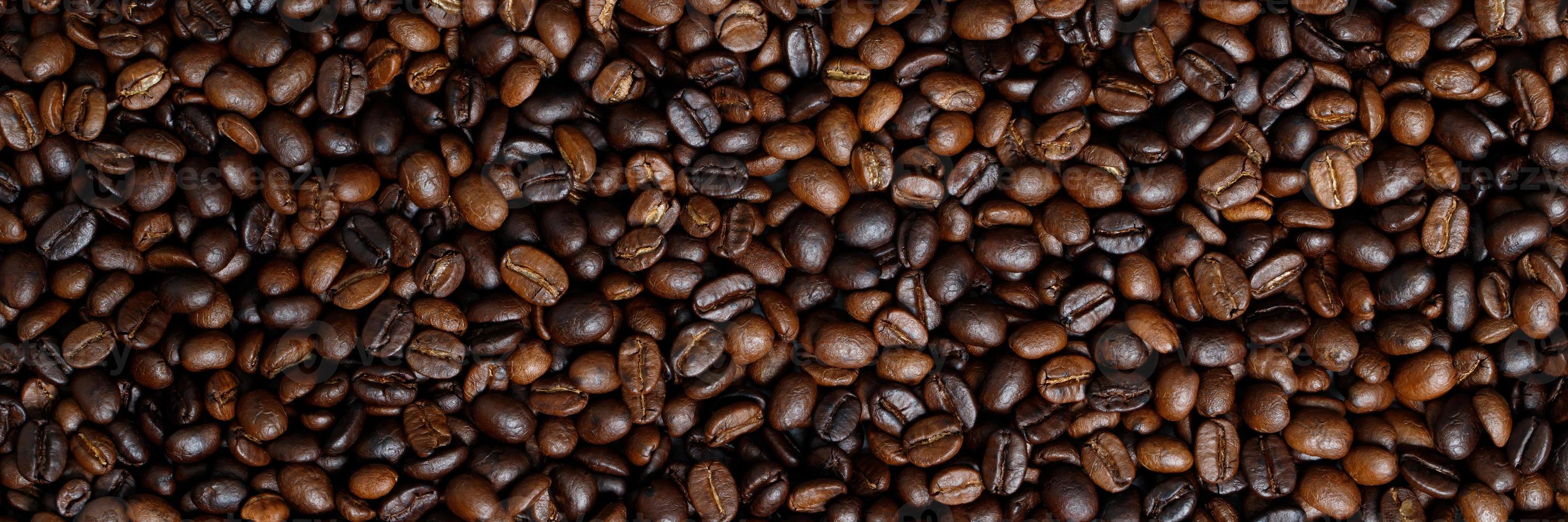 photo macro close up texture of roasted coffee beans dark, can be used as a background.