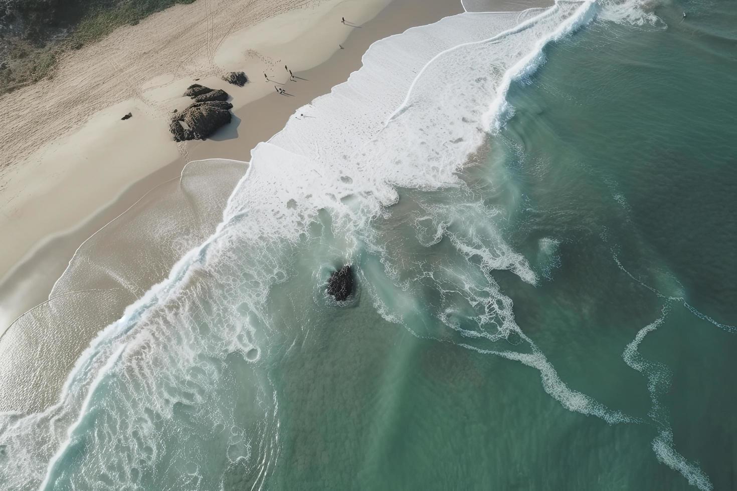 drone view of beach with waves and turquoise water photo