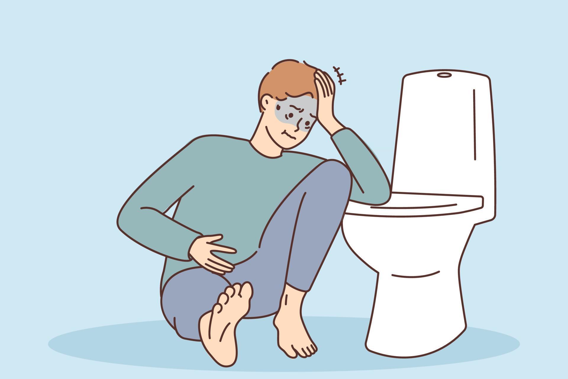 Unhealthy young man sitting near toilet suffer from food poisoning or