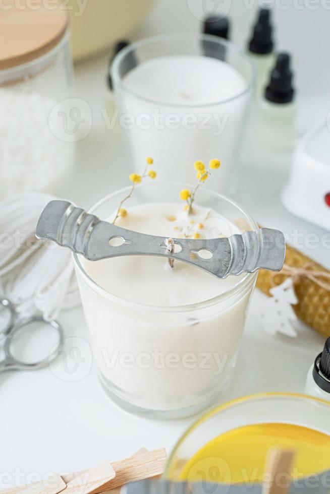 closeup of wooden wick in handmade candle photo