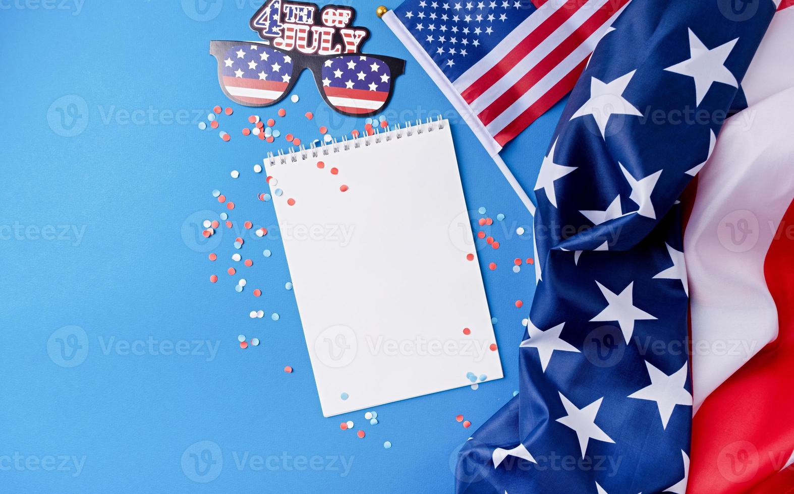 Blank white frame for mockup design on American national flag blue background with decorations photo