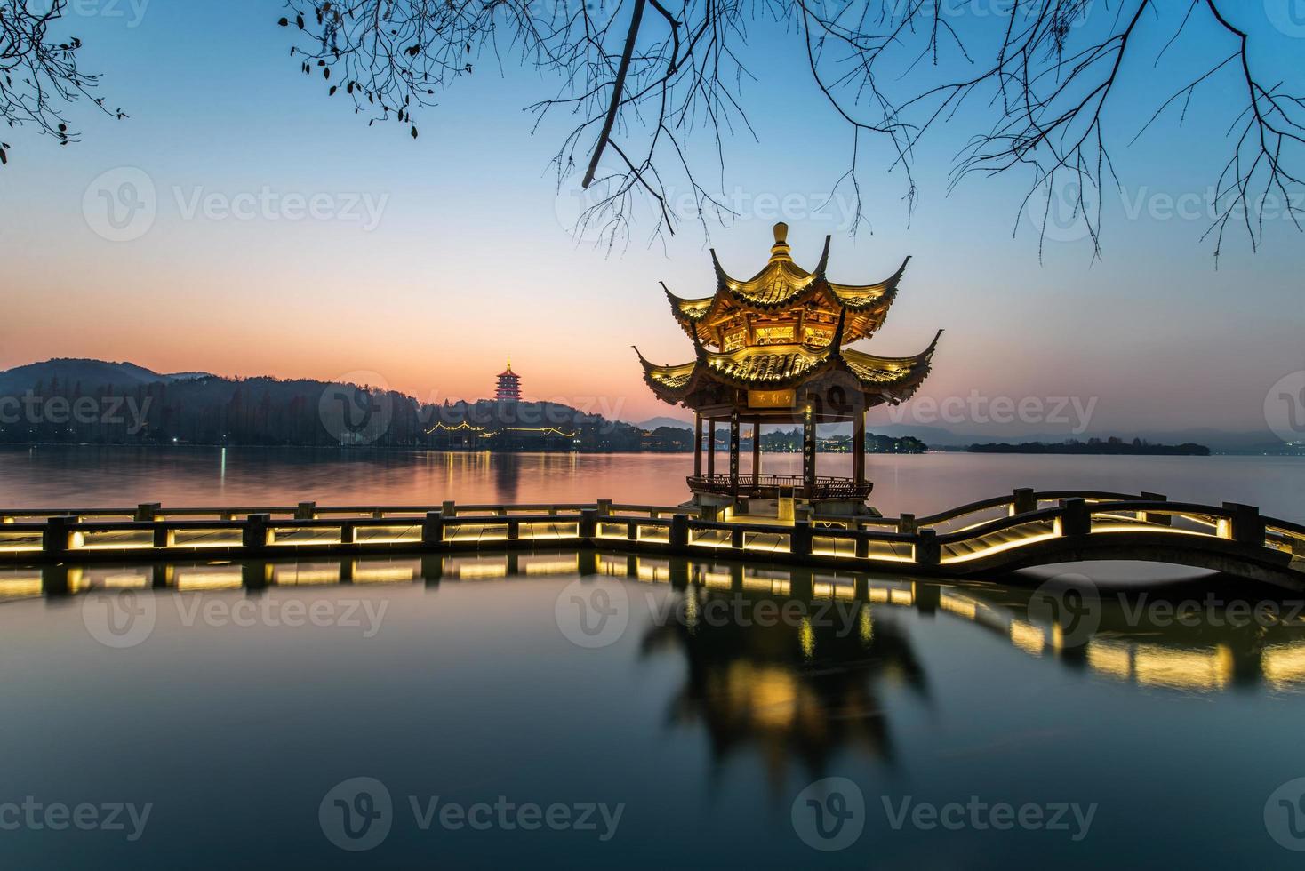 beautiful hangzhou in sunset and ancient pavilion photo