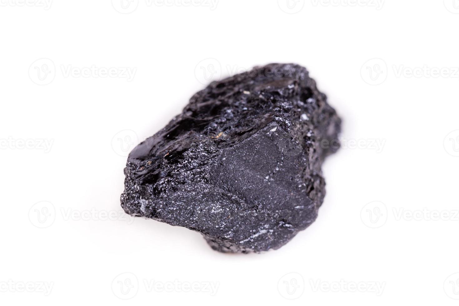 Macro mineral stone sorrel - black tourmaline on white background photo