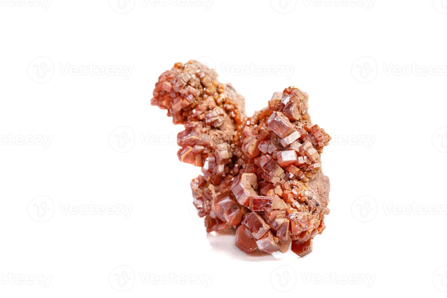 Macro mineral stone Vanadinite on a white background photo