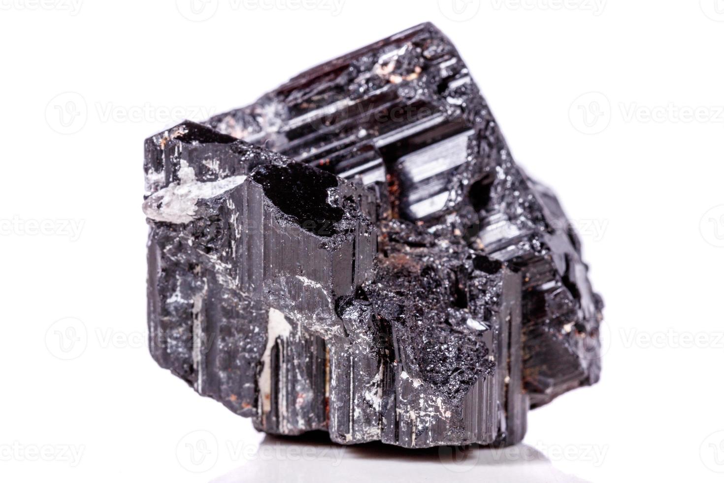 macro mineral stone sherle, schorl, black tourmaline on white background photo