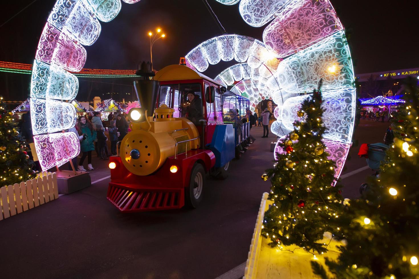 Belarus, the city of Gomil, December 10, 2019. The holiday of lighting the Christmas tree.Christmas city. New Year's illumination on the street. City Christmas square in the lights. photo
