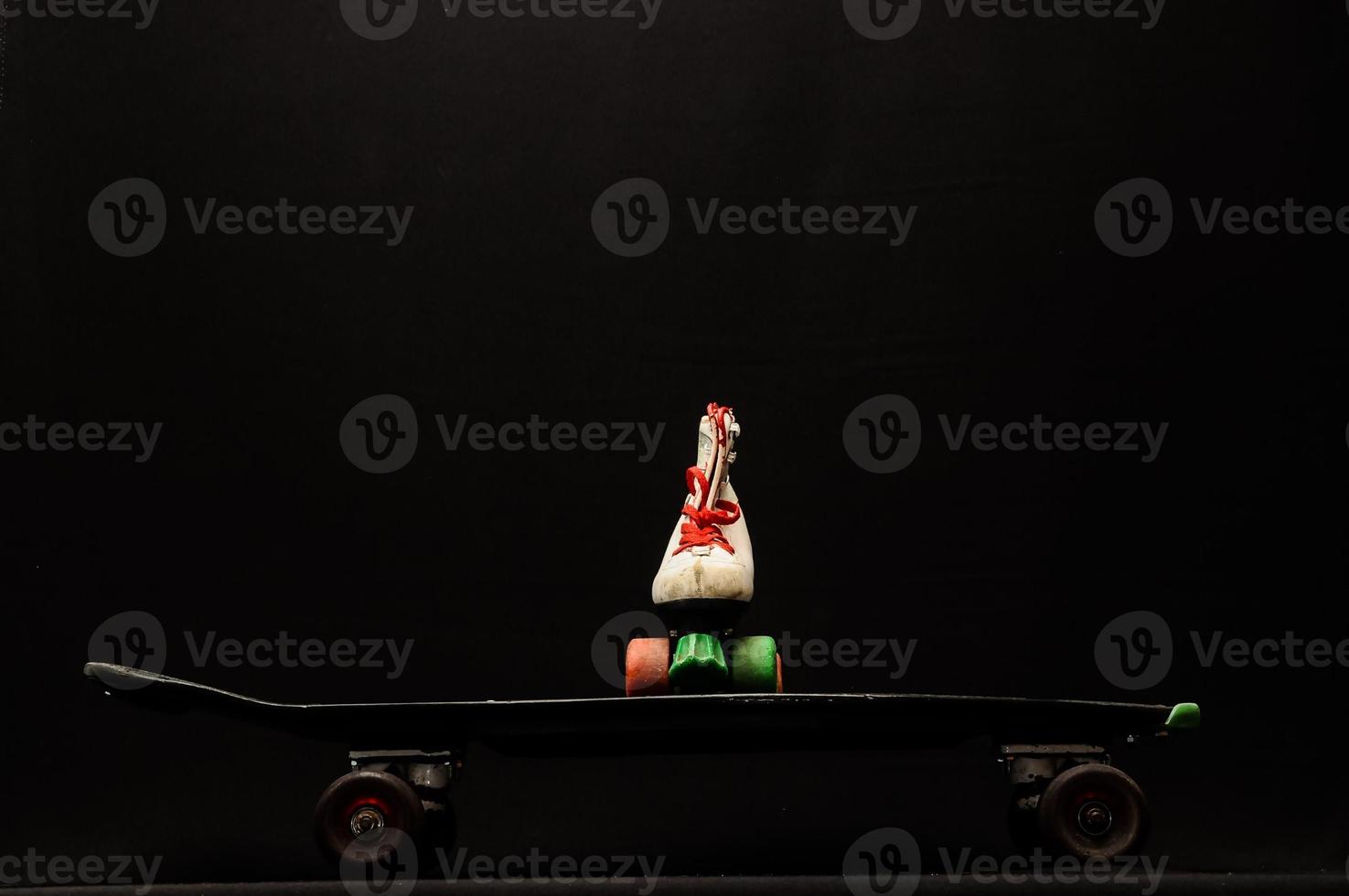 Isolated skateboard and skate photo