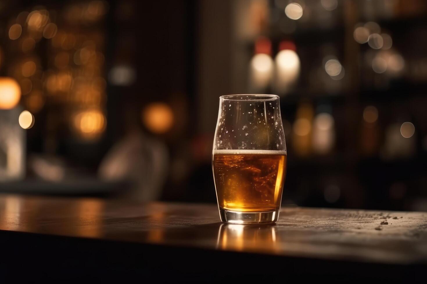 Glass of beer on a table in a bar on blurred bokeh background photo
