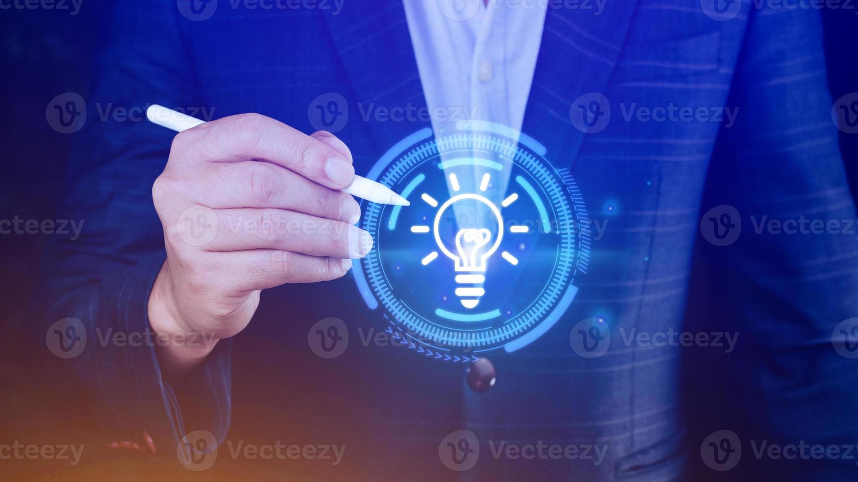 Businessman touching light bulb icon Bright idea, new idea concept with innovation and inspiration, technology in science and communication concept. photo