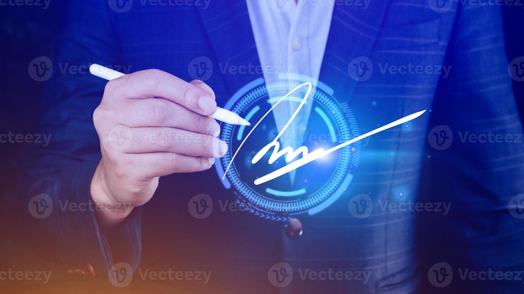 Electronic Signature Concept, Electronic Signing Businessman signs electronic documents on digital documents on virtual screen using stylus pen, Paperless workplace idea. photo