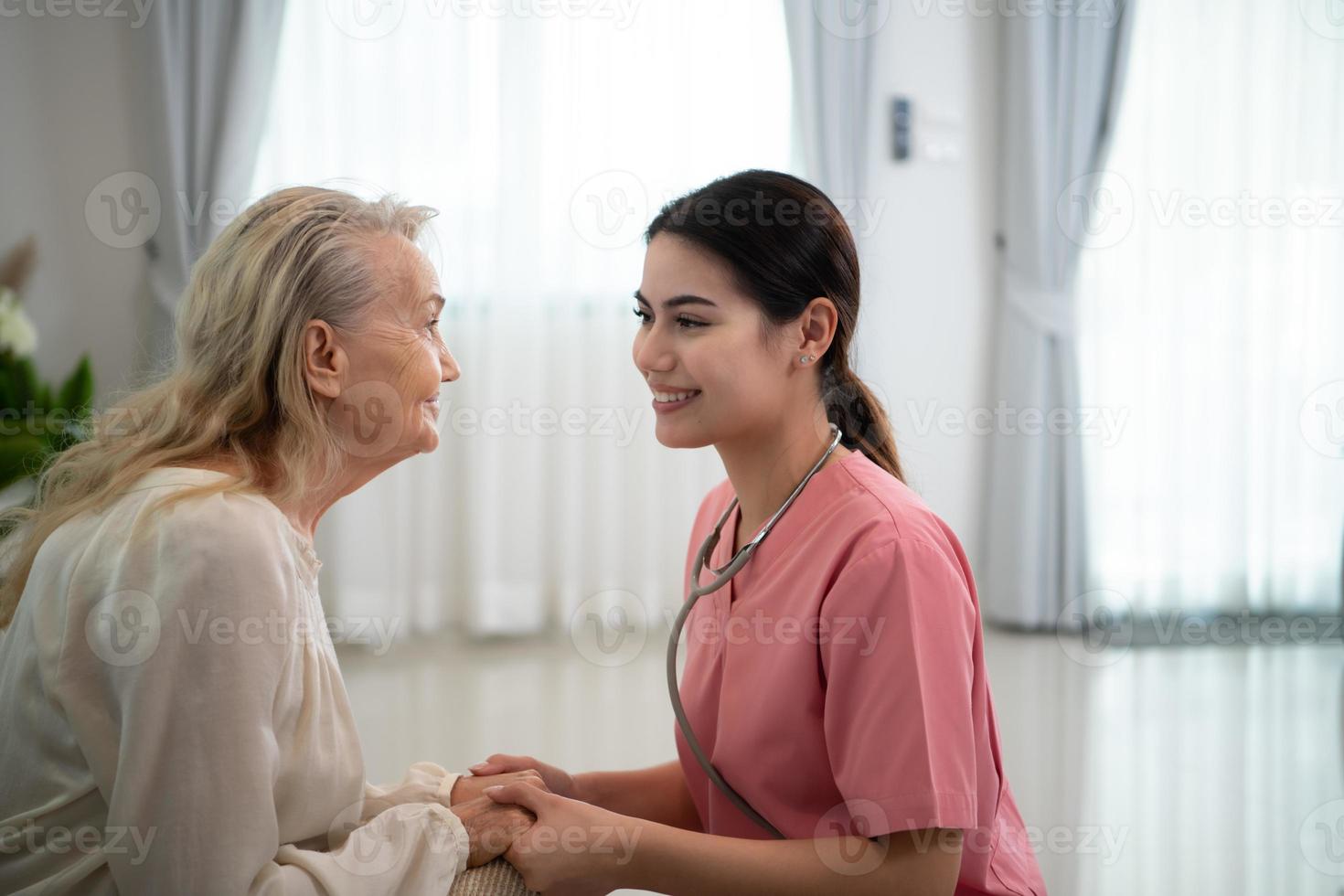 Caregiver for an elderly woman Weekly check-ups at the patient's residence. Ready to give medical advice and talk about various stories, exchange each other happily. photo