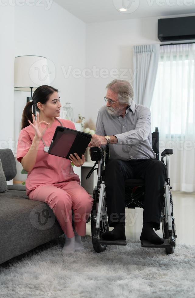 Caregiver for an elderly man Weekly check-ups at the patient's residence. Ready to give medical advice and talk about various stories, exchange each other happily. photo