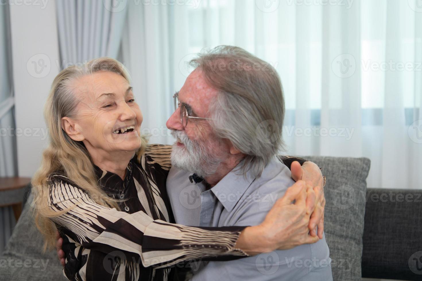 A long-term relationship that lasts till old age, characterized by unwavering affection. Still expressing affection and joyfully hugging one another. photo