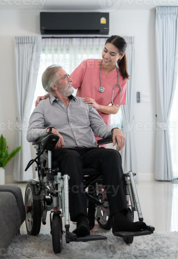 Caregiver for an elderly man Weekly check-ups at the patient's residence. Ready to give medical advice and talk about various stories, exchange each other happily. photo