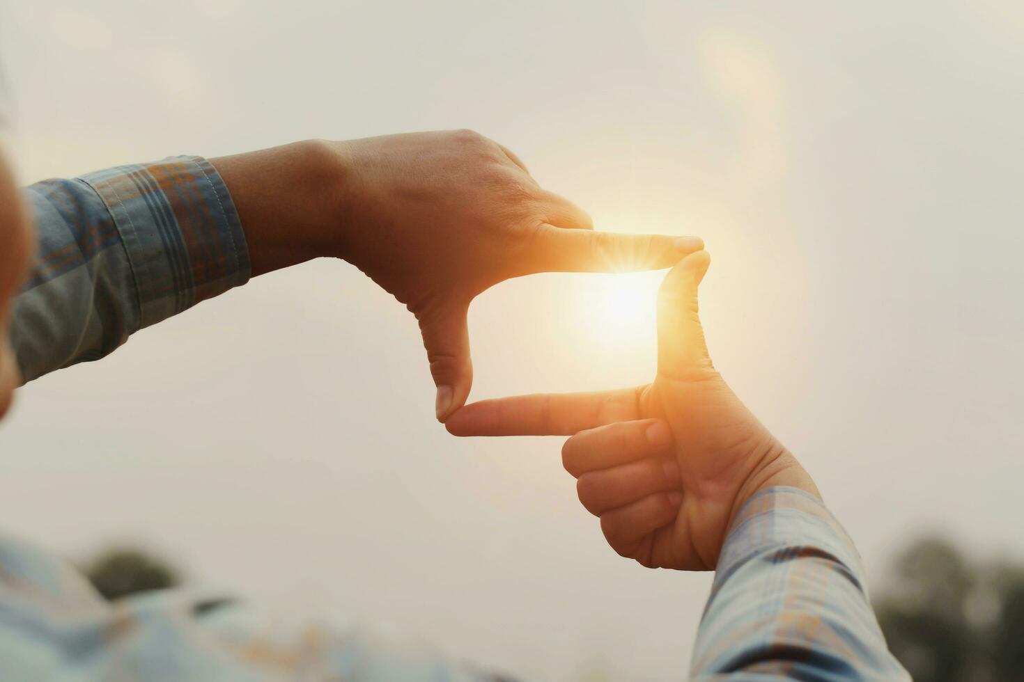 close up woman make hand framing gesture distant view. business concept photo