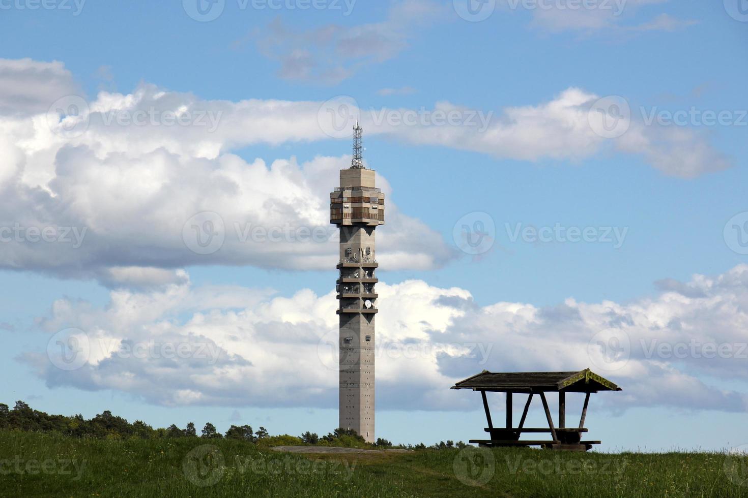 A lighthouse is a navigational landmark that is used to identify coasts and locate ships. photo