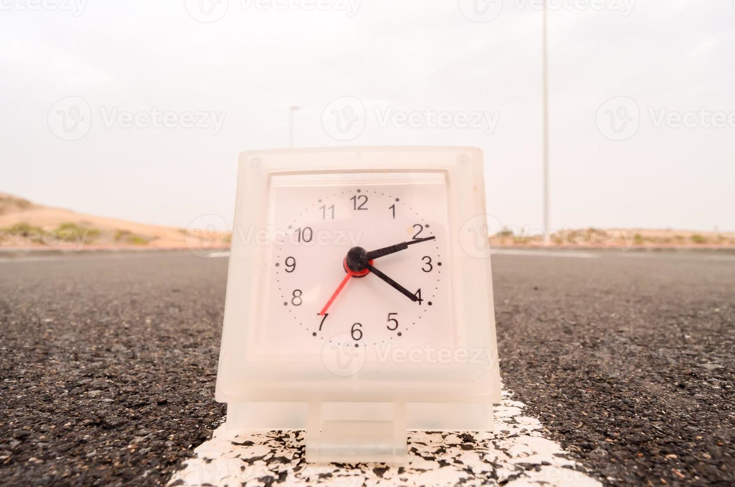 Clock on the road photo