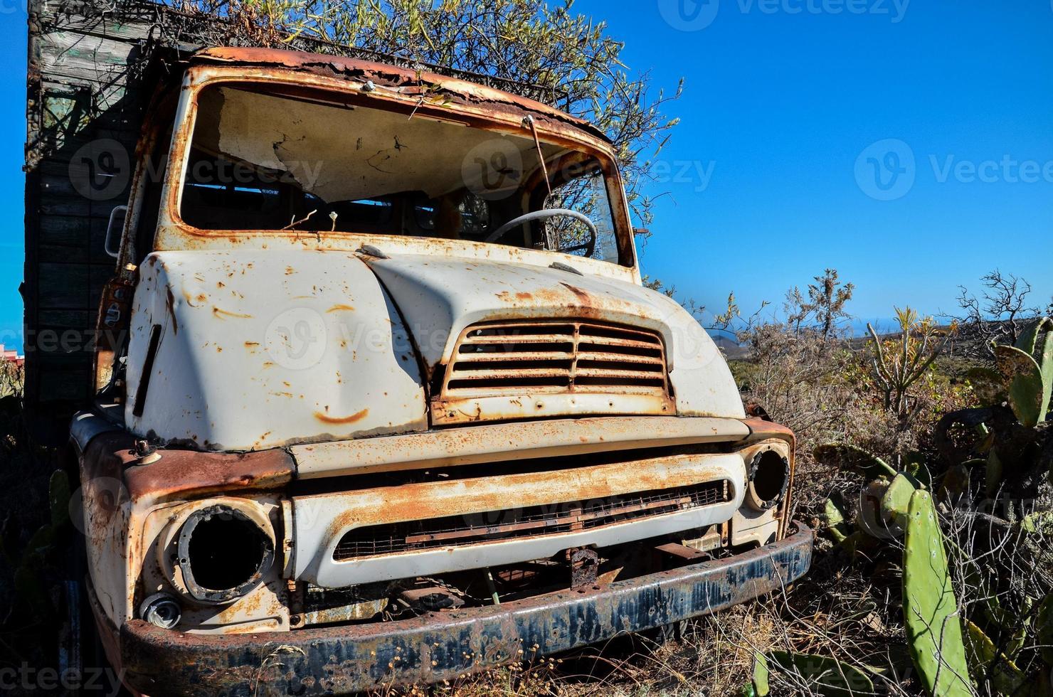 Abandoned rusty vehicles photo