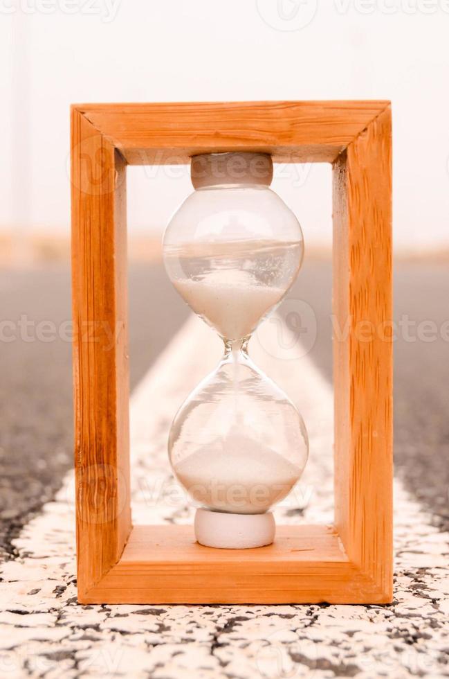 Hourglass on the road photo