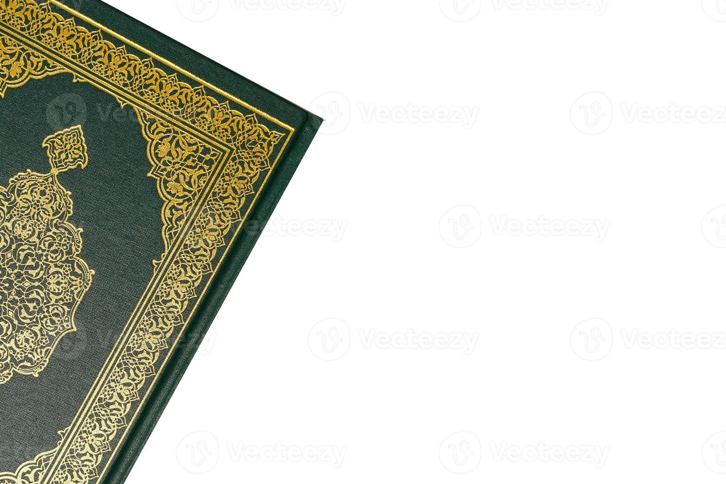 The Holy Al Quran with written arabic calligraphy meaning of Al Quran and rosary beads or tasbih on white background, isolated with copy space. photo