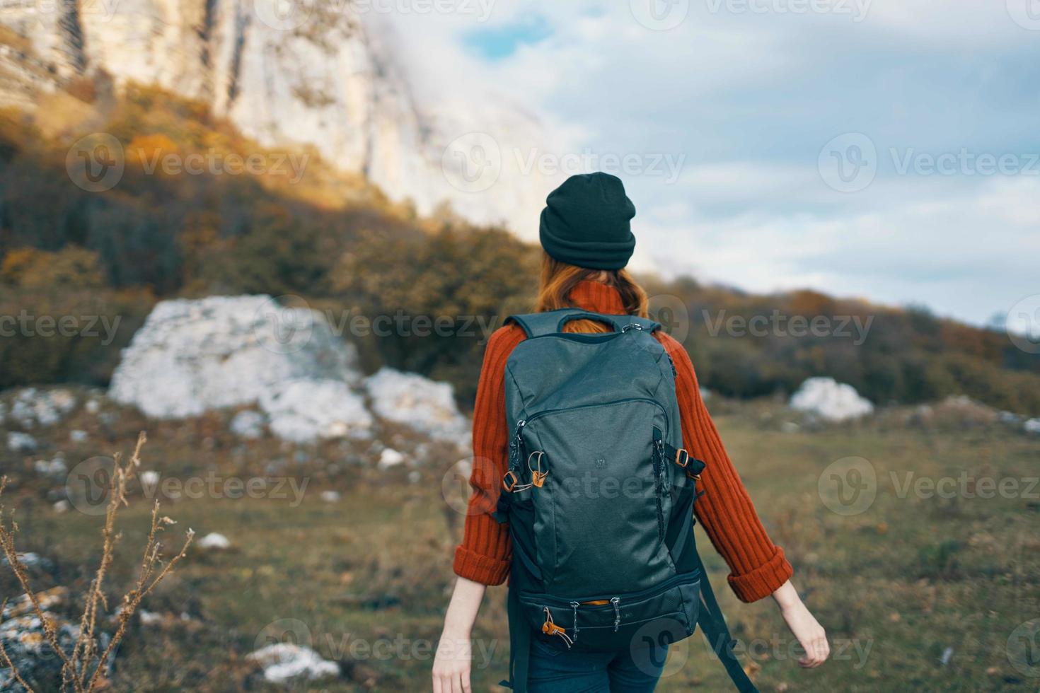 woman tourist with cutter near mountains travel landscape adventure photo