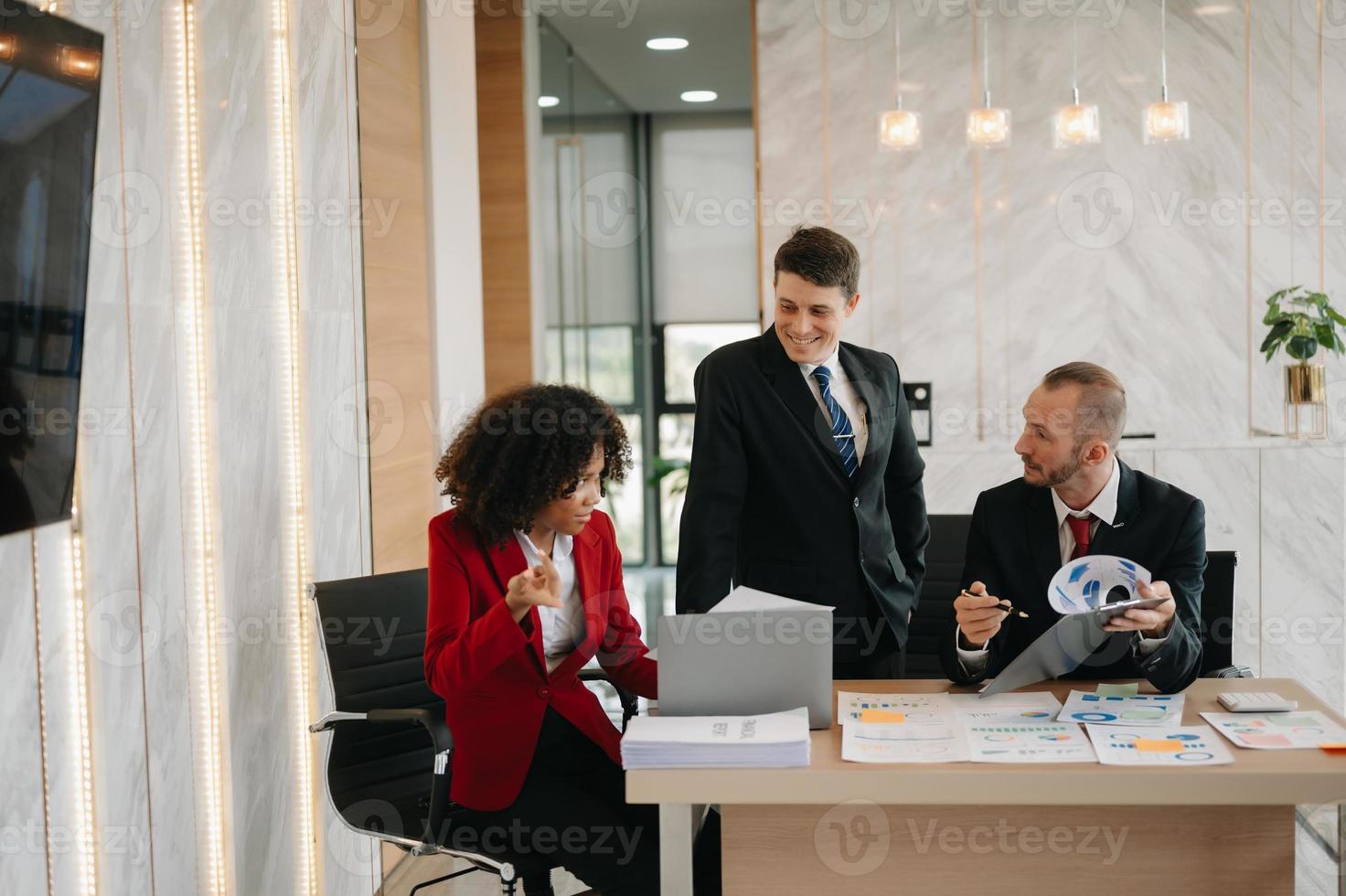 Young business creative team are brainstorming planning discussing while sitting in creative business discussing work in the office photo