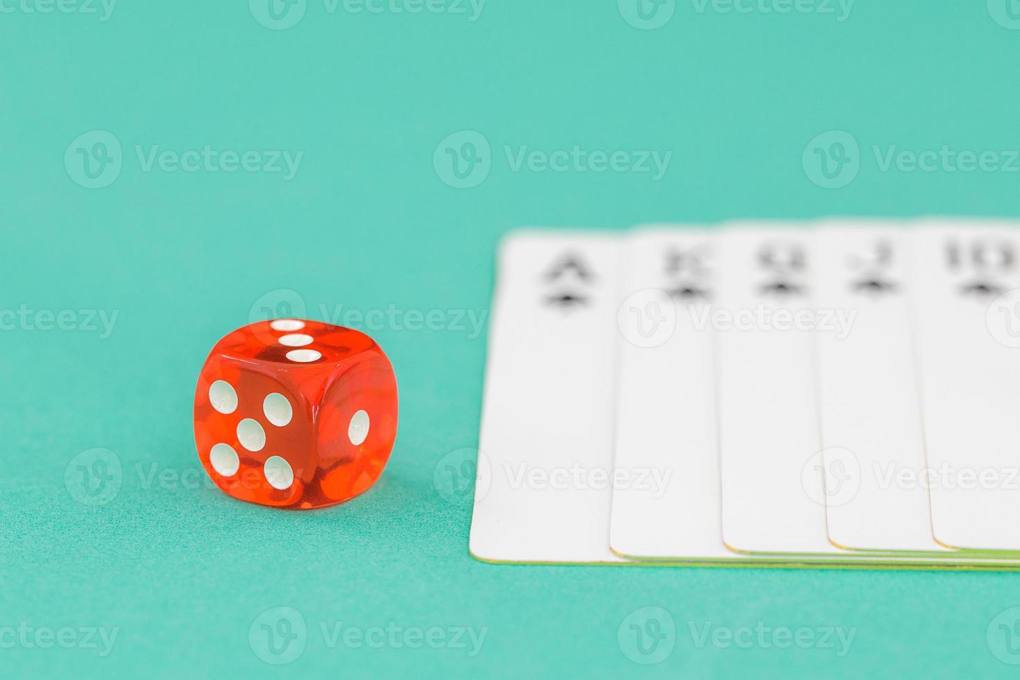 Dices and cards on green casino table photo