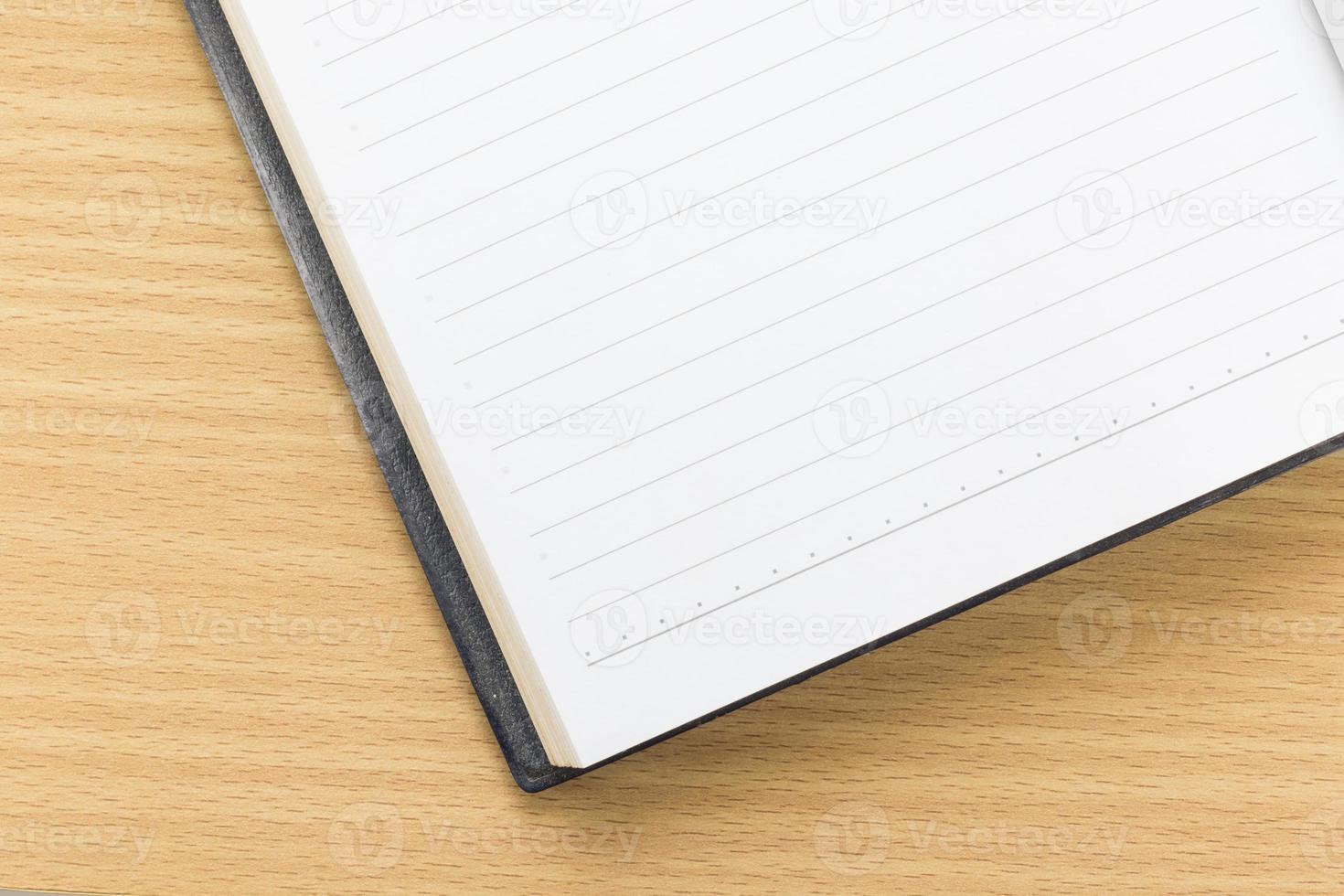 Open notebook with blank page photo