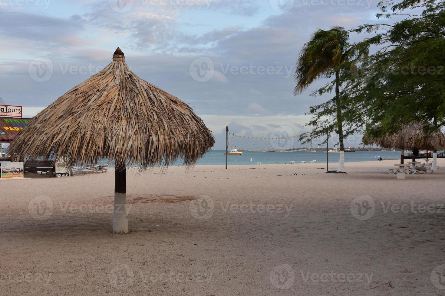 Palapa Sitting Unused on a Tropical Beach photo