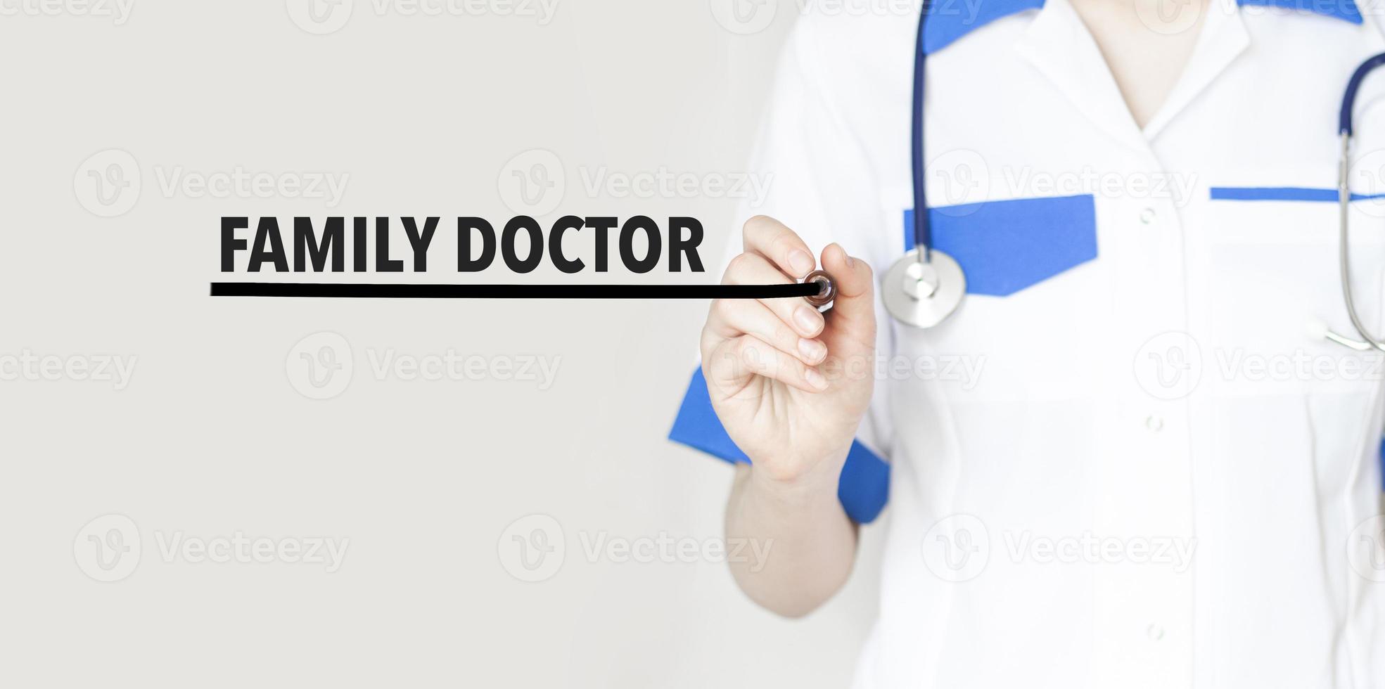 Doctor writting text family doctor with marker, medical concept photo