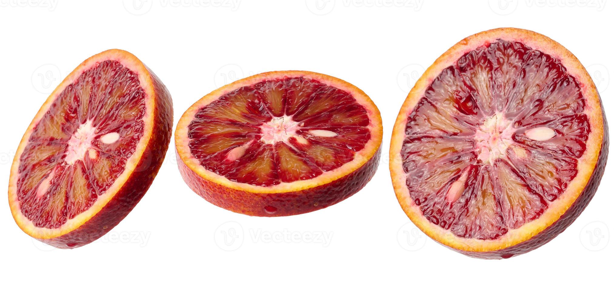 Juicy round piece of red orange on a white isolated background, top view photo