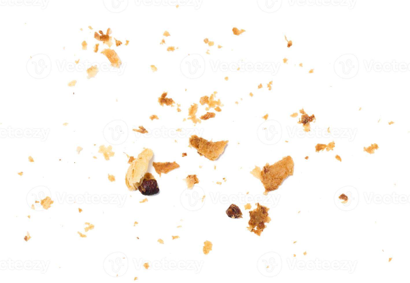 A lot of crumbs of puff -baked dough on a white isolated background photo