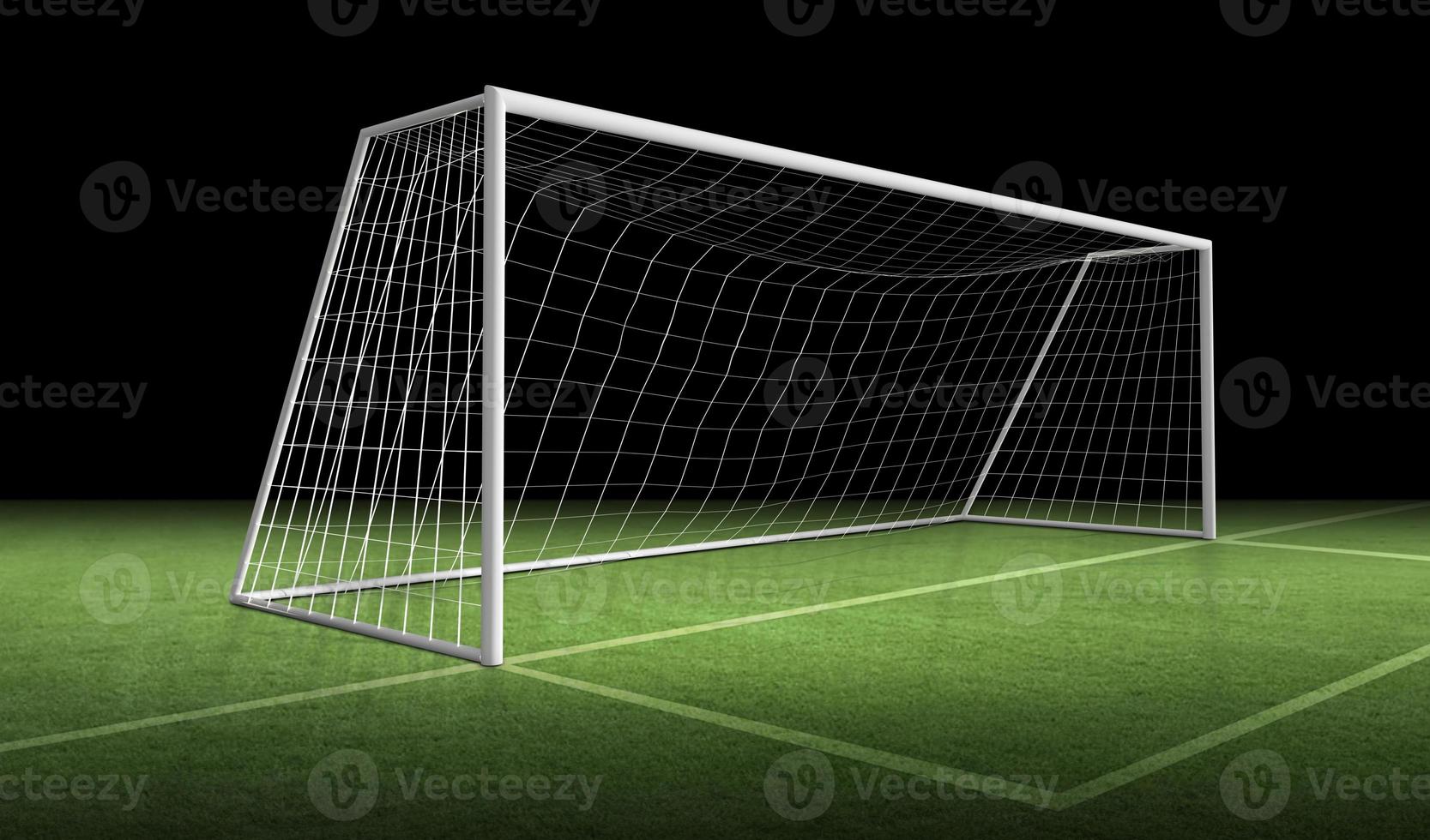 Soccer goal post and soccer net on green grass photo