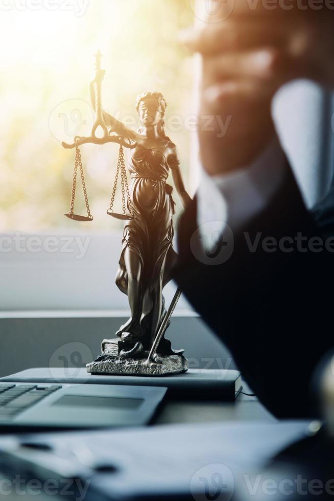 Judge gavel with Justice lawyers having team meeting at law firm background. Concepts of Law and Legal services. photo