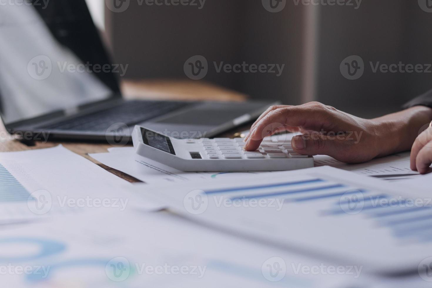 Close up bookkeepers working with balance sheet to analyze problems and find solutions to bringing develop business organization and company's stock market system. Common stock and preferred stock. photo
