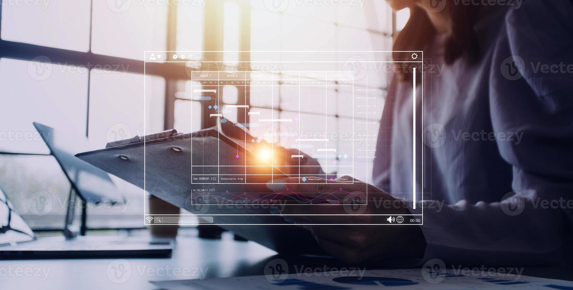 Project manager working with Gantt chart schedule to plan tasks and deliverables. Scheduling activities with a planning software, Corporate strategy for finance, operations, sales, marketing. photo