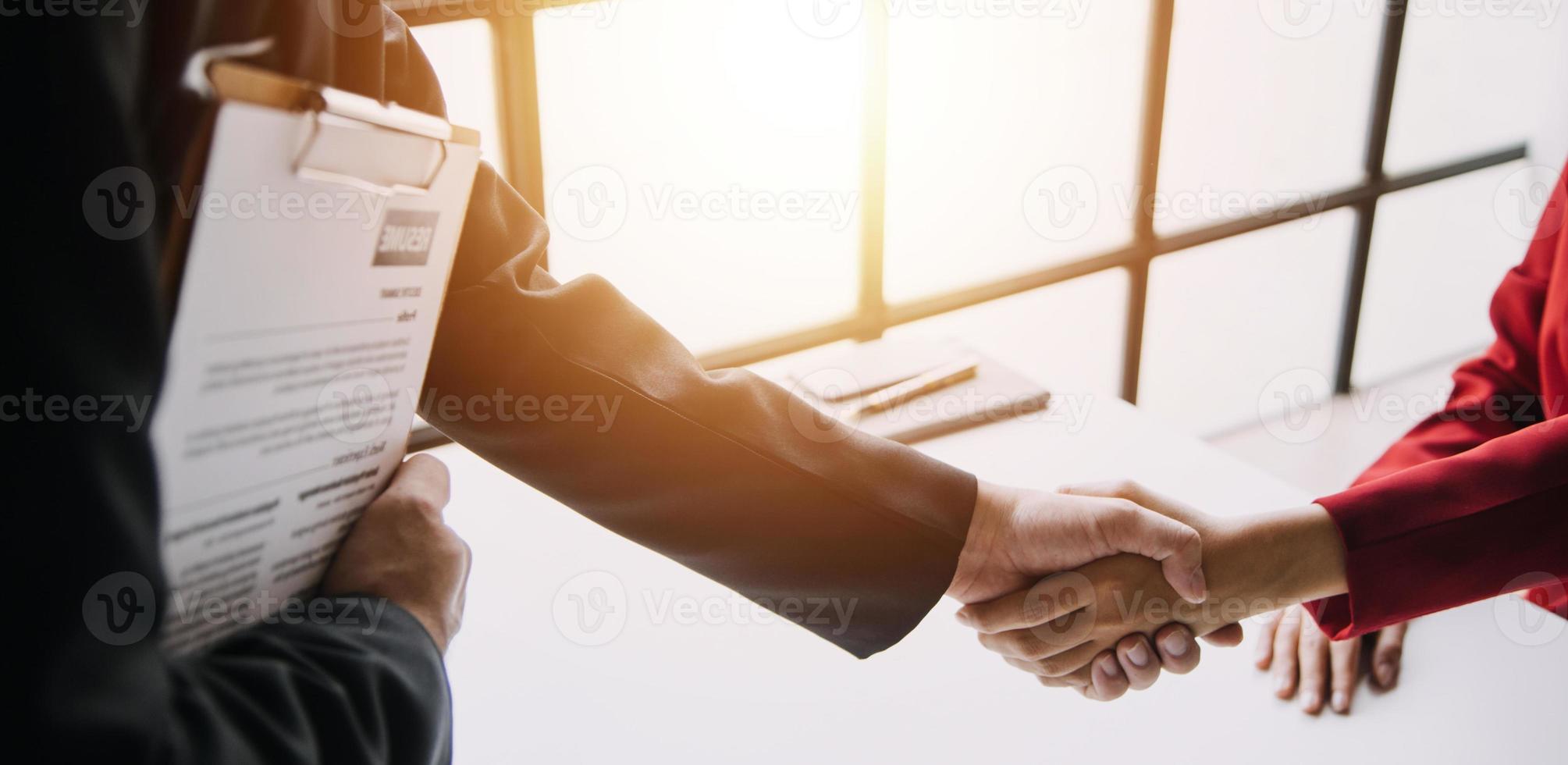 Close up view of job interview in office, focus on resume writing tips, employer reviewing good cv of prepared skilled applicant, recruiter considering application, hr manager making hiring decision photo