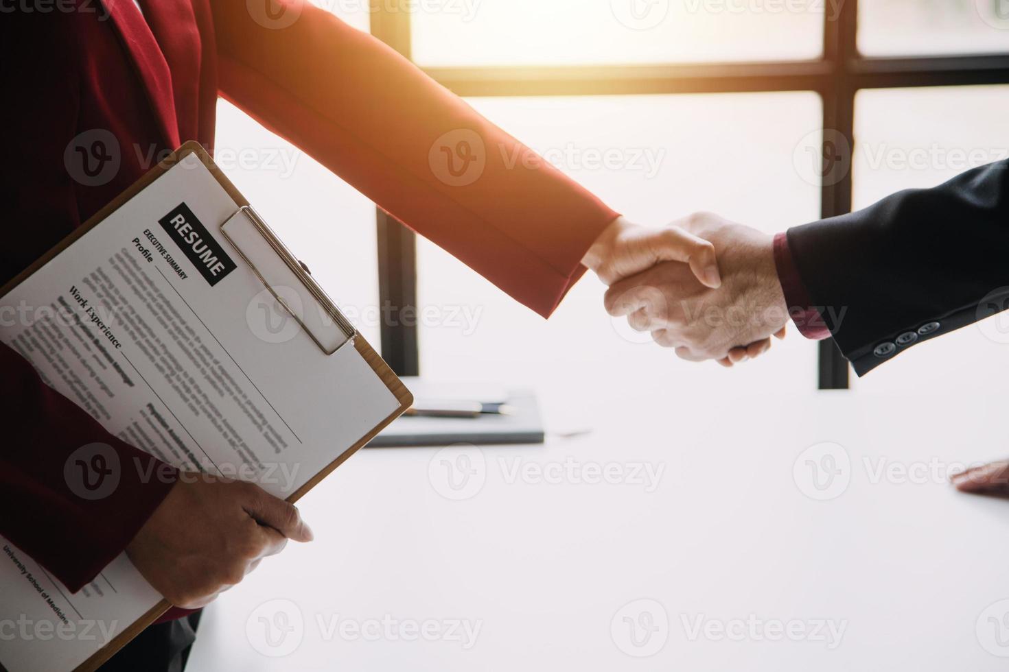 Close up view of job interview in office, focus on resume writing tips, employer reviewing good cv of prepared skilled applicant, recruiter considering application, hr manager making hiring decision photo