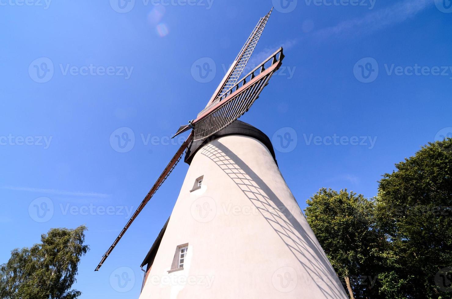 A white windmill 22208835 Stock Photo at Vecteezy
