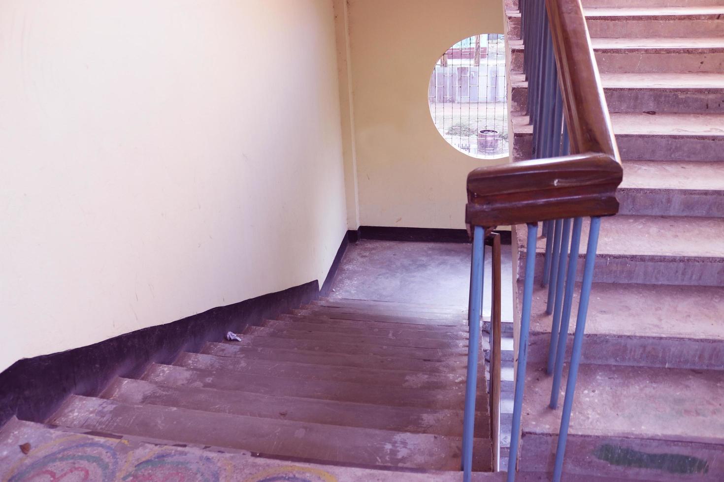 Rangpur,Bangladesh 2023. Staircase with wood railing.Stairs in a modern College University building.Luxury custom built home interior. white walls and a staircase.Spiral staircase photo
