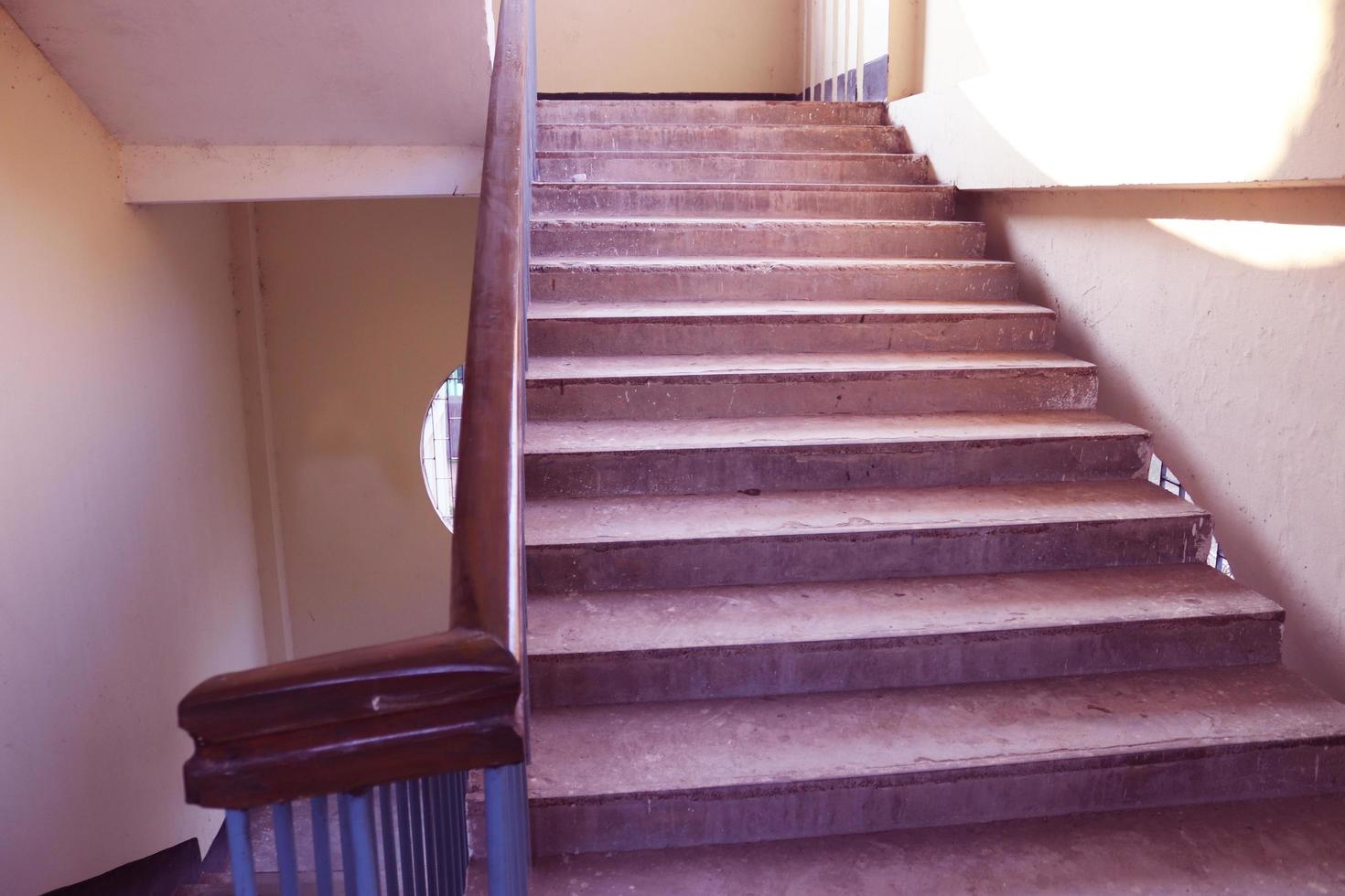 Rangpur,Bangladesh 2023. Staircase with wood railing.Stairs in a modern College University building.Luxury custom built home interior. white walls and a staircase.Spiral staircase photo